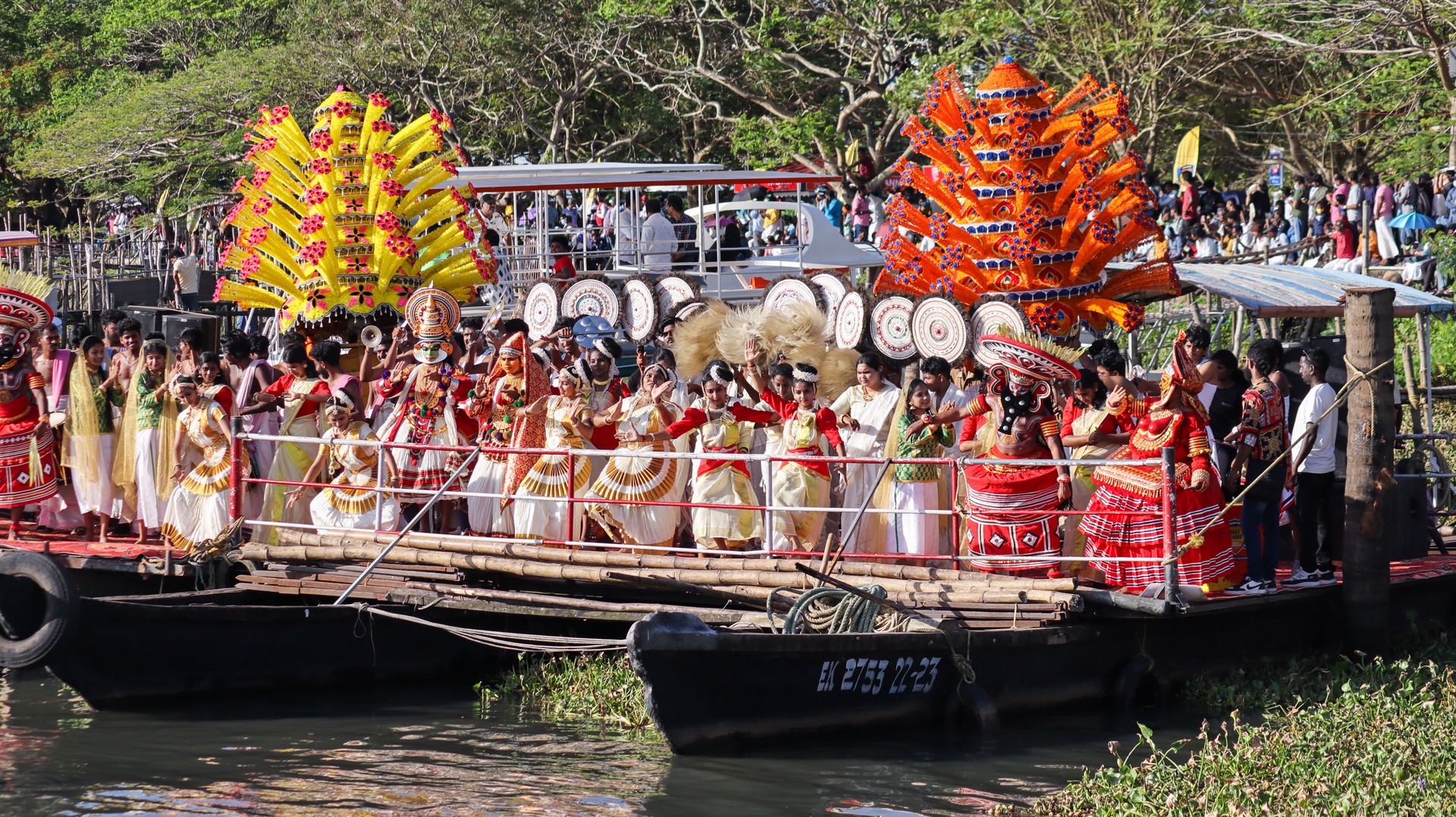 A Group of Women and Men in their traditional Kerala costume sing and dance during the Onam religious festival at a waterfront in Kochi city of Kerala in India.