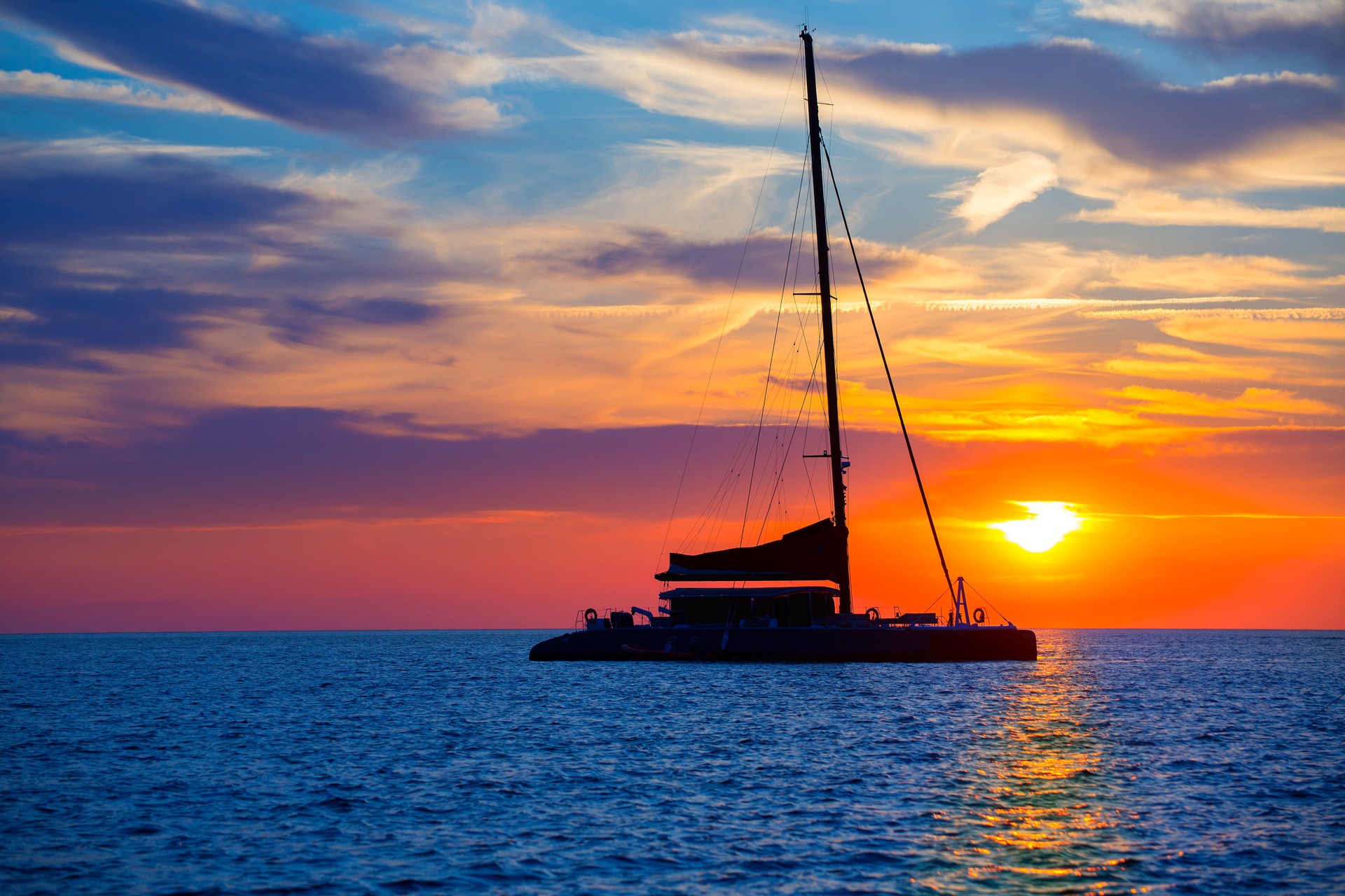 Ibiza san Antonio Abad catamaran sailboat sunset